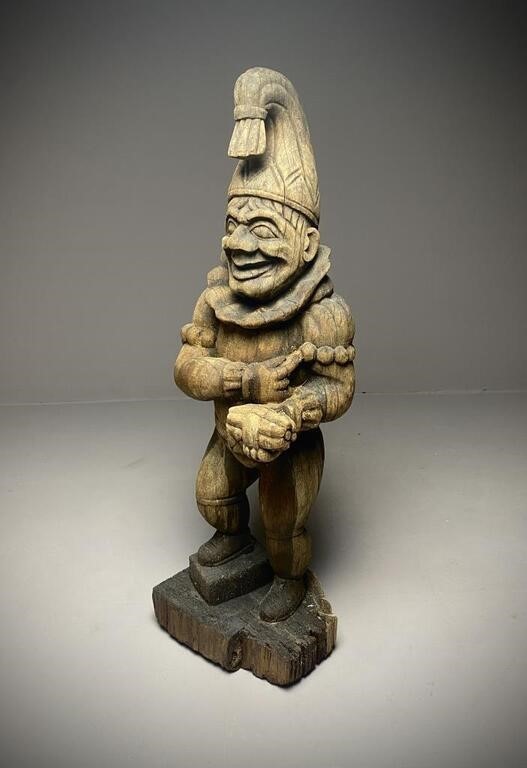 Carved wooden Punch cigar store figure sold at auction